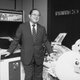 Namco founder Masaya Nakamura poses next to a Puck-Man machine at the company’s Tokyo office on November 6, 1982.